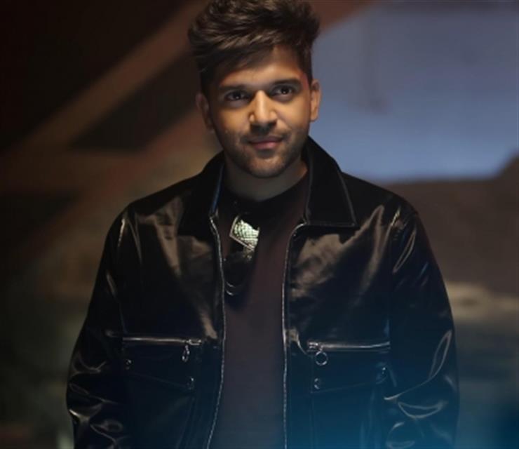 Download Guru Randhawa Sporty Cap Wallpaper | Wallpapers.com