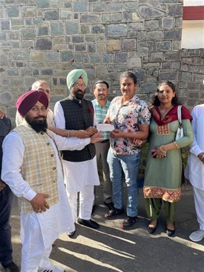 Sports Minister Rana Sodhi hands over Rs.10 lakh cheque to Tokyo Olympics qualifier Kamalpreet Kaur