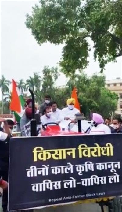 Rahul drives tractor to Parliament, demands withdrawal of 3 farm laws
