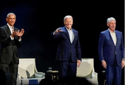 Obama, Clintons praise Biden