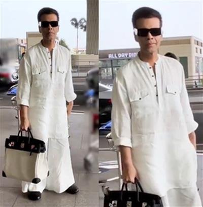 Karan Johar breaks his airport fashion stereotype with sombre outfit