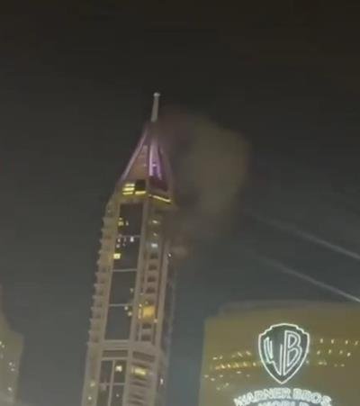 UAE air defences intercept Iranian missiles, debris hits tower in Dubai Marina