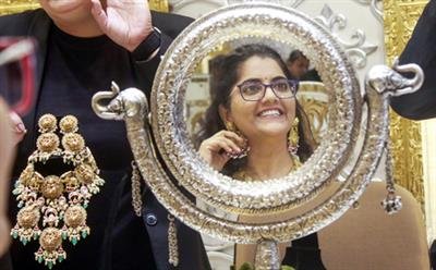 Gold slips on strong dollar, silver rebounds on MCX; Rupee hits record low